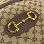creating a seamless contrast that enhances its overall aesthetic. The gold-toned hardware further elevates its elegance