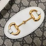 a symbol borrowed from the equestrian world and firmly established in Gucci’s genetic code.The bag is constructed from beige/ebony GG Supreme canvas