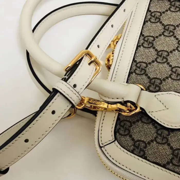 a material that is environmentally friendly. It boasts gold-toned hardware and is lined with luxurious cotton linen for added sophistication. The front features a captivating Horsebit detail