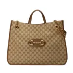 the perfect accessory for the modern woman. With its rounded edges and soft shape