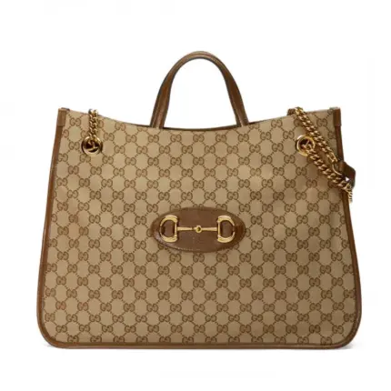 the perfect accessory for the modern woman. With its rounded edges and soft shape