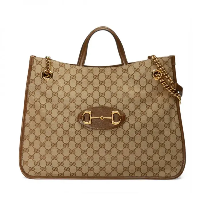 the perfect accessory for the modern woman. With its rounded edges and soft shape