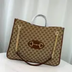 this tote bag is a standout from the Gucci 1955 Horsebit collection for Spring Summer 2020. Crafted from GG Supreme canvas with elegant brown leather trim
