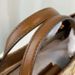 this tote bag offers ample space for all your essentials. The original GG canvas and brown leather trim exude luxury
