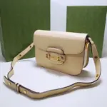 the bag exudes a timeless charm. It is adorned with gold-toned hardware