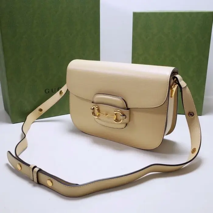 the bag exudes a timeless charm. It is adorned with gold-toned hardware