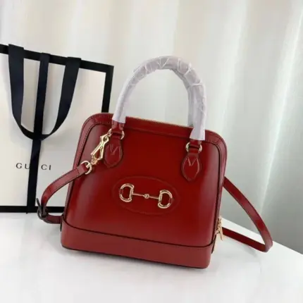 the Gucci 1955 Horsebit Leather Small Top Handle Bag 621220. With a size of W25cm x H24cm x D9cm