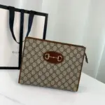 the Gucci 1955 Horsebit Pouch 621890. This stylish accessory measures 10.2 inches in width