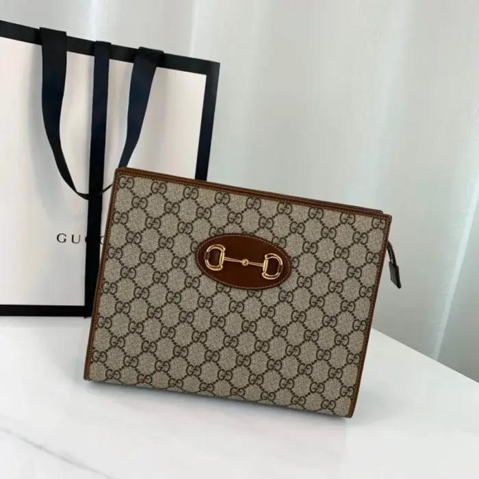 the Gucci 1955 Horsebit Pouch 621890. This stylish accessory measures 10.2 inches in width