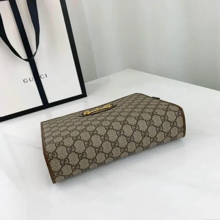 this pouch features the iconic double ring and bar design