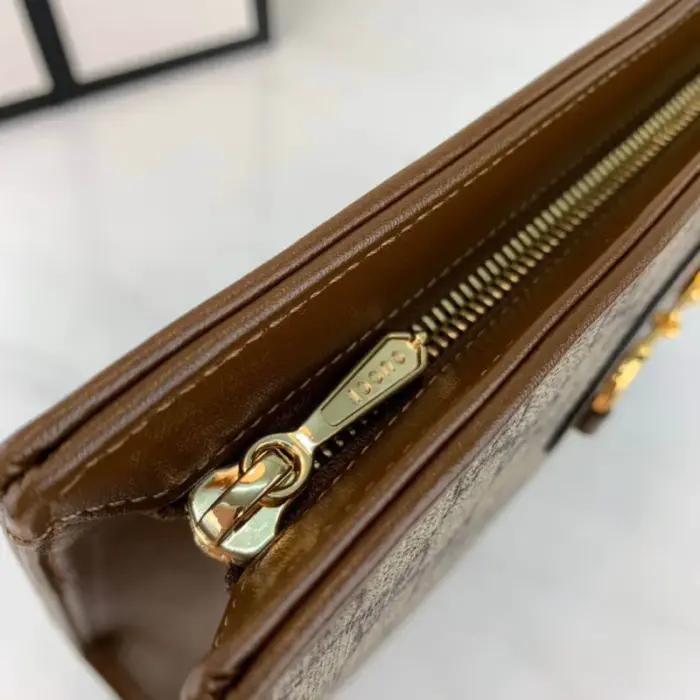 this pouch is made from beige/ebony GG Supreme canvas