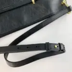 adding a touch of opulence. This harmonious combination of black leather and gold accents creates a visually striking contrast.The interior is lined with microfiber
