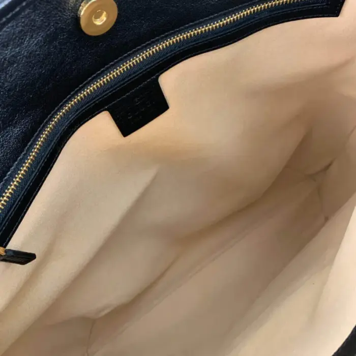 but it also offers functionality. The bag is equipped with a drawstring closure detail