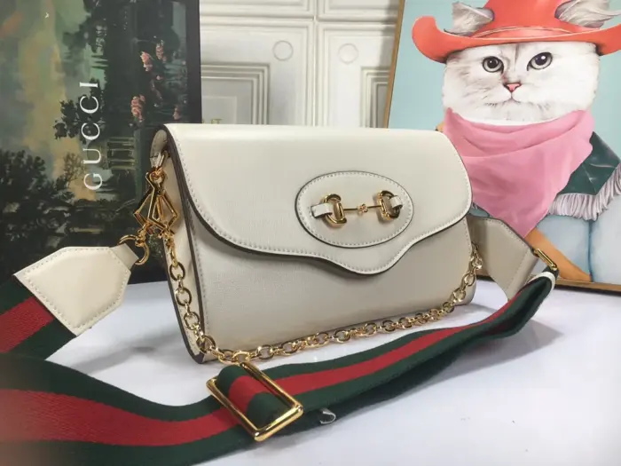 adding a touch of Gucci’s signature aesthetic. The second strap is made of gold-toned chain