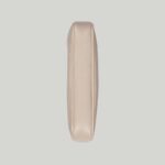 it's presented in a soft white leather with a gold-toned zip closure.