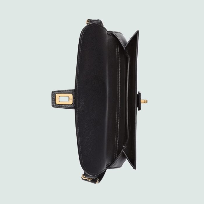 continues as part of Exquisite Gucci. The gold-toned buckle adds a refined vintage feel to this new belt bag style in black leather