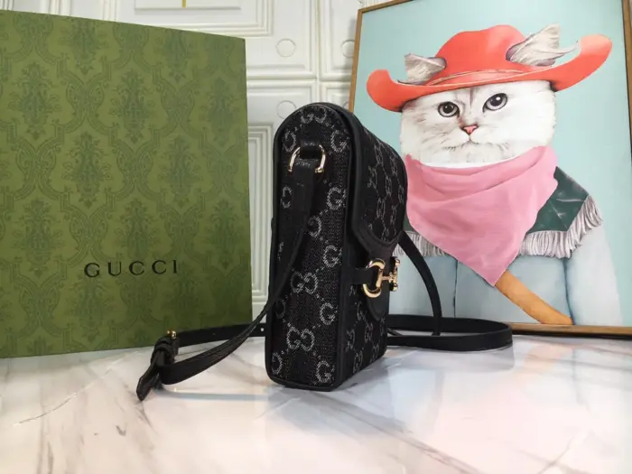 this bag features iconic logo details such as the allover GG motif and Horsebit