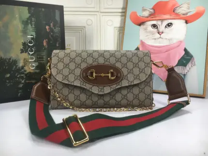 The Gucci Double G Horsebit 1955 Small Bag in beige is a stylish and versatile accessory. Crafted from beige and ebony GG Supreme canvas with brown leather trim