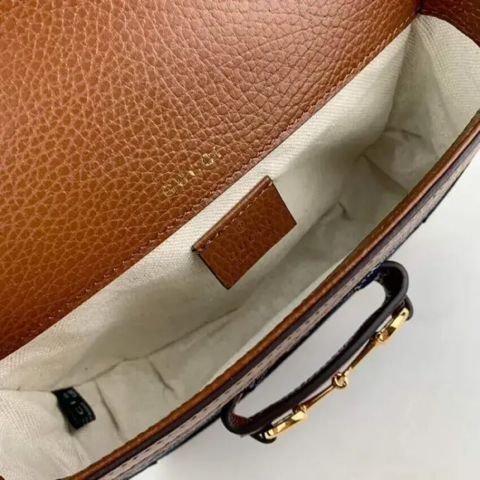 the bag boasts a dark blue and ivory eco-washed organic GG jacquard denim exterior