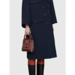 a symbol first introduced by Gucci in the 1950s. Crafted from the brand’s signature GG canvas material