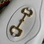 providing a compact yet functional space for your essentials.The gold-toned hardware further elevates the bag’s aesthetic appeal