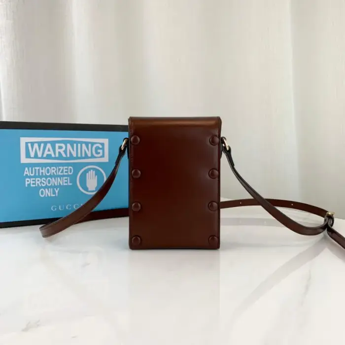 this mini bag showcases the iconic double ring and bar design