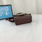 adding a touch of elegance to its overall aesthetic. Its microfibre lining with a suede-like finish ensures a luxurious feel and protects your belongings.What makes this bag even more desirable is its environmentally friendly production process. The leather used is made through an alternative chrome-free tanning method