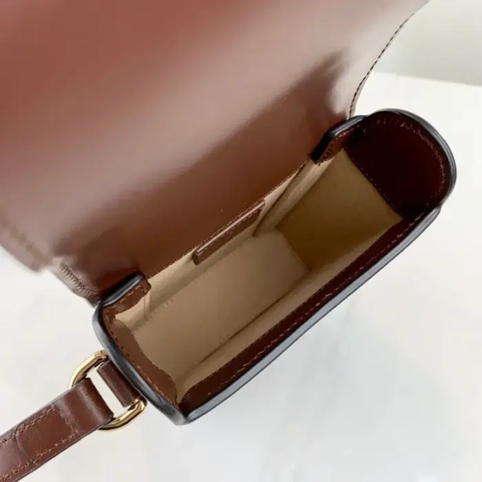 ensuring comfort and versatility in wear. The flap closure completes the bag’s timeless design.The Gucci Horsebit 1955 Mini Bag encapsulates the essence of Gucci’s iconic 1955 Horsebit collection