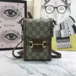 The Gucci Horsebit 1955 Mini Bag 625615 is a captivating accessory crafted in Italy. Made from the iconic beige and ebony GG supreme canvas