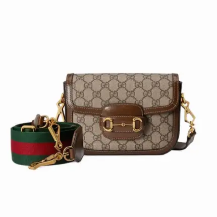 Introducing the stunning Gucci Horsebit 1955 Mini Bag in GG Supreme 658574. This exquisite bag has dimensions of 8.1 inches in width