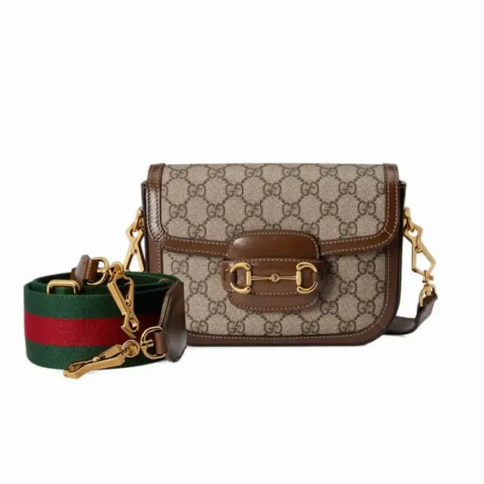 Introducing the stunning Gucci Horsebit 1955 Mini Bag in GG Supreme 658574. This exquisite bag has dimensions of 8.1 inches in width