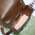 this bag is not just stylish but also environmentally conscious. The brown leather trim and gold-toned hardware add a touch of elegance and sophistication to the overall design. The microfiber lining boasts a luxurious suede finish
