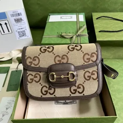 <p>The Gucci Horsebit 1955 Shoulder Bag With Jumbo GG 602204 is a stunning bag that channels the iconic design of Gucci. Its dimensions are 9.8 inches in width