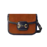 Introducing the Gucci Horsebit 1955 Small Bag 602204 Brown Corduroy – a modern recreation of an iconic archival design. This exquisite shoulder bag showcases the original lines and forms that were first introduced over six decades ago
