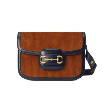 Introducing the Gucci Horsebit 1955 Small Bag 602204 Brown Corduroy – a modern recreation of an iconic archival design. This exquisite shoulder bag showcases the original lines and forms that were first introduced over six decades ago