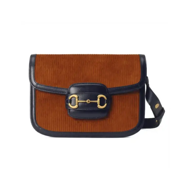 Introducing the Gucci Horsebit 1955 Small Bag 602204 Brown Corduroy – a modern recreation of an iconic archival design. This exquisite shoulder bag showcases the original lines and forms that were first introduced over six decades ago