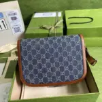 and 3.1 inches in depth (20.5 x 14.5 x 5.5 cm). Crafted from a dark blue and ivory eco washed organic GG jacquard denim