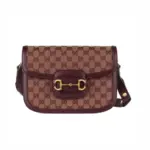 The Burgundy GG Canvas Gucci Horsebit 1955 Small Bag 602204 is a stunning recreation of a classic design. Made from beige and burgundy Original GG canvas