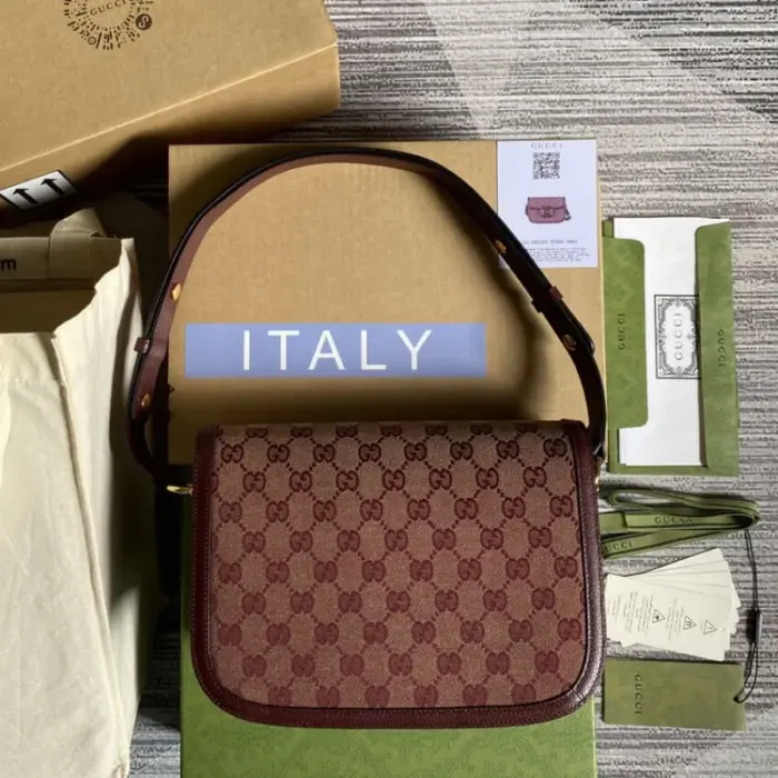 adding a touch of elegance to its overall aesthetic. The iconic Horsebit detail is prominently displayed at the front of the bag