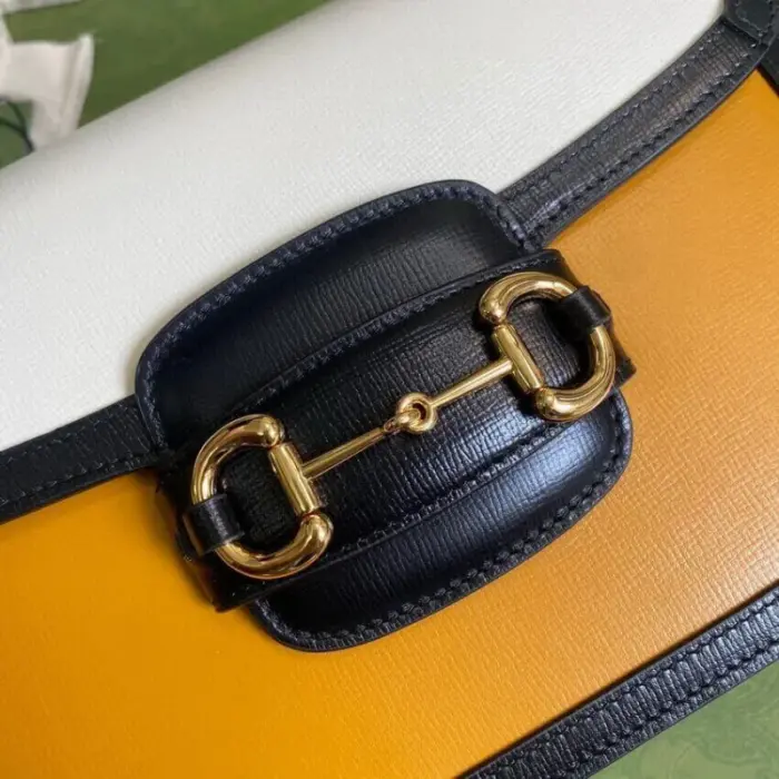 complemented by blue leather trim and gold-toned hardware.The Horsebit detail takes center stage on the front of the bag