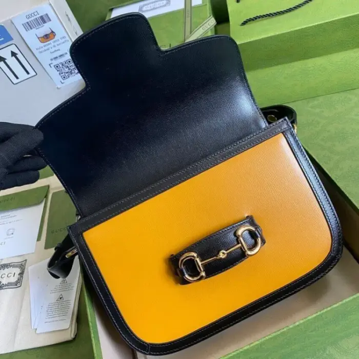 adding a touch of elegance and sophistication. The bag is designed with three gussets