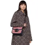 crafted with attention to detail. It features a contrasting blue leather trim that adds a touch of elegance to the overall look.The dimensions of this bag are 9.8 inches in width