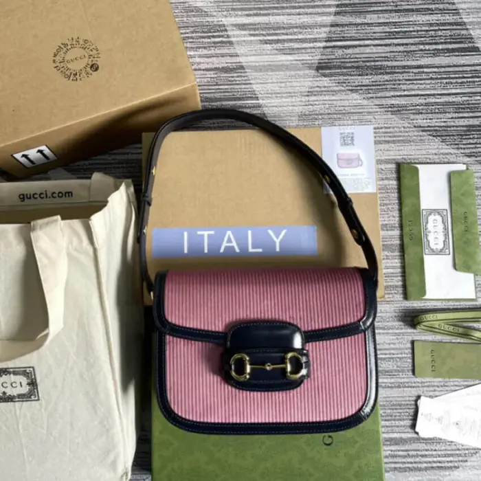making it the perfect size for your everyday essentials. The pink corduroy material gives it a unique and stylish appearance.The gold-toned hardware complements the design and adds a luxurious touch. The iconic Horsebit detail is featured prominently at the front