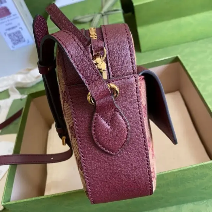 showcasing its equestrian influence with elegance and flair. The interior of the bag offers a convenient zip pocket