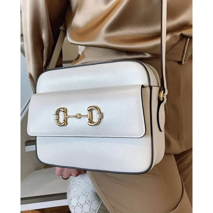 this bag features a double ring and bar detail that represents the brand’s heritage.Made from high-quality brown textured leather