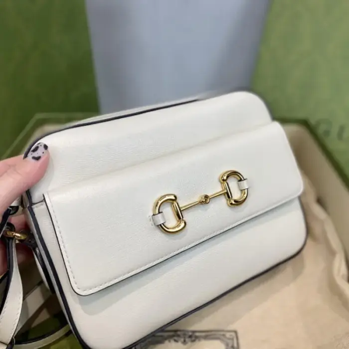 and 2.6 inches in depth.The bag is adorned with gold-toned hardware