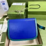 this bag incorporates jewel tones throughout its design. With dimensions of 9.8 inches in width