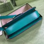 and this bag is no exception. Its bright green leather stands out