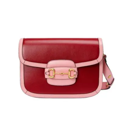 Introducing the stunning Gucci Horsebit 1955 Small Shoulder Bag in a vibrant red and pink leather combination. With dimensions of 9.8 inches in width