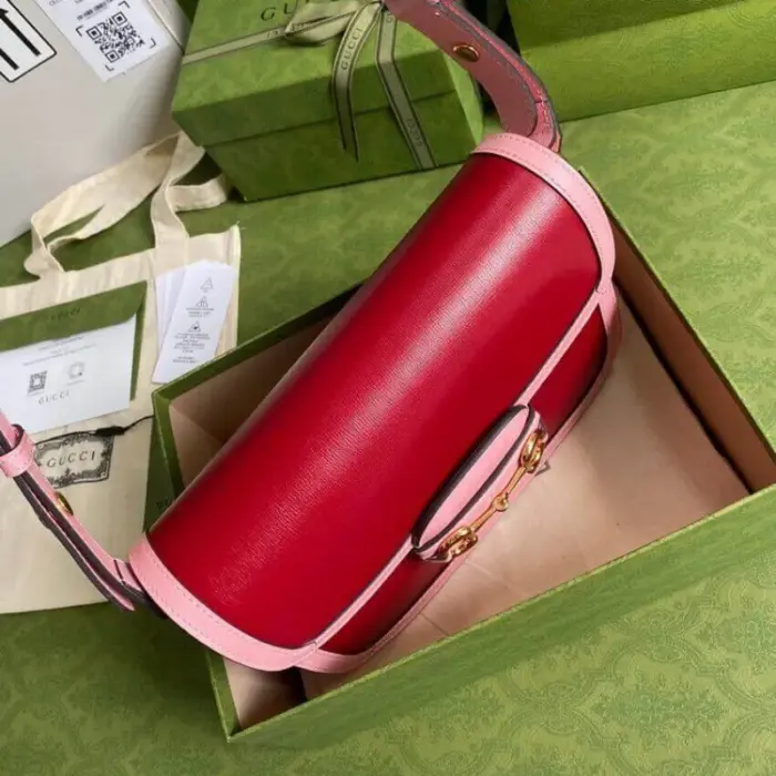while half Horsebit details can be found on each side.One unique feature of this bag is the inclusion of a small pouch with two additional button covers. When the shoulder strap is lengthened